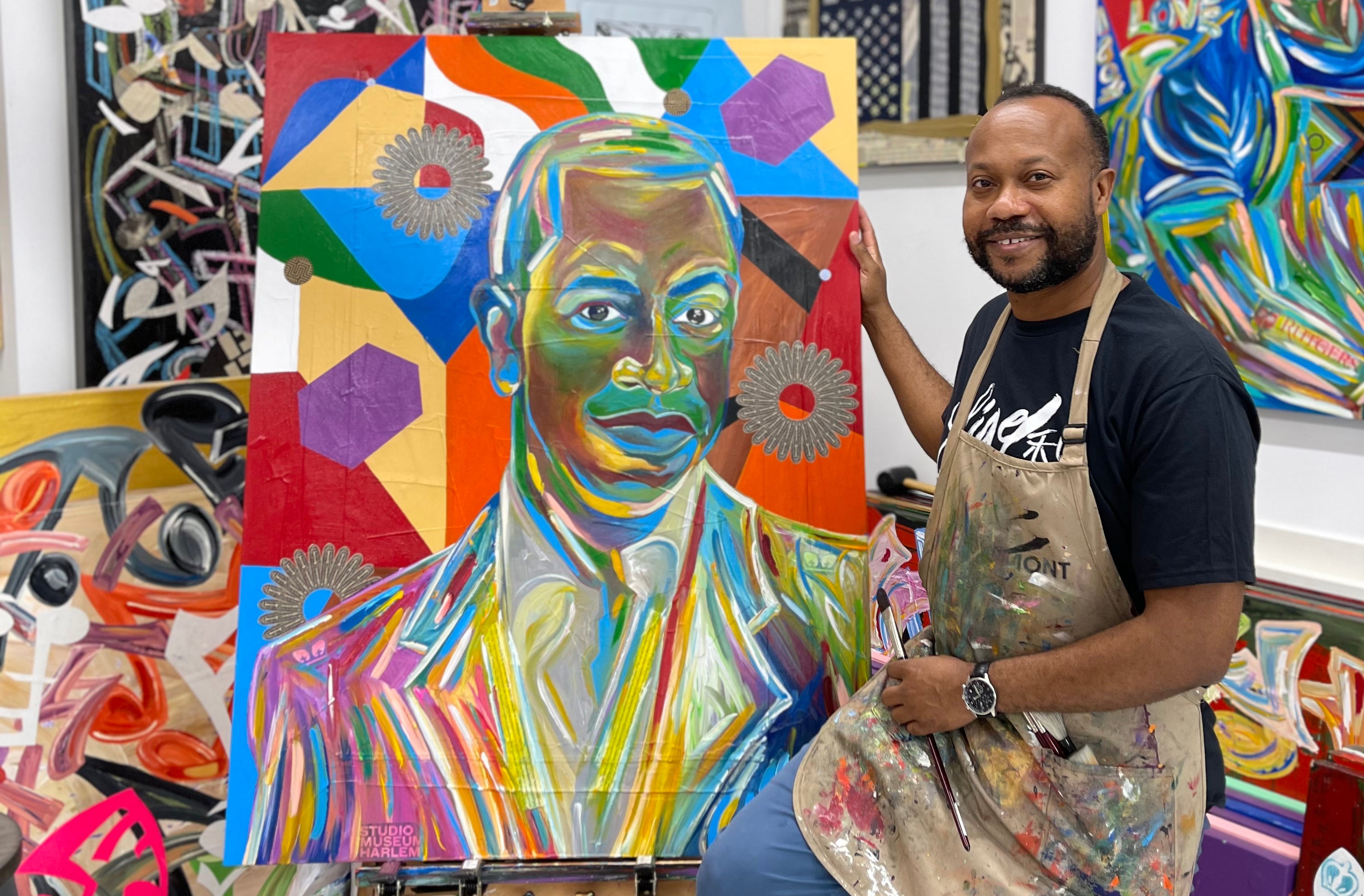 Load video: Ligel Lambert Creating a Symbolic Painting of Sanford Biggers